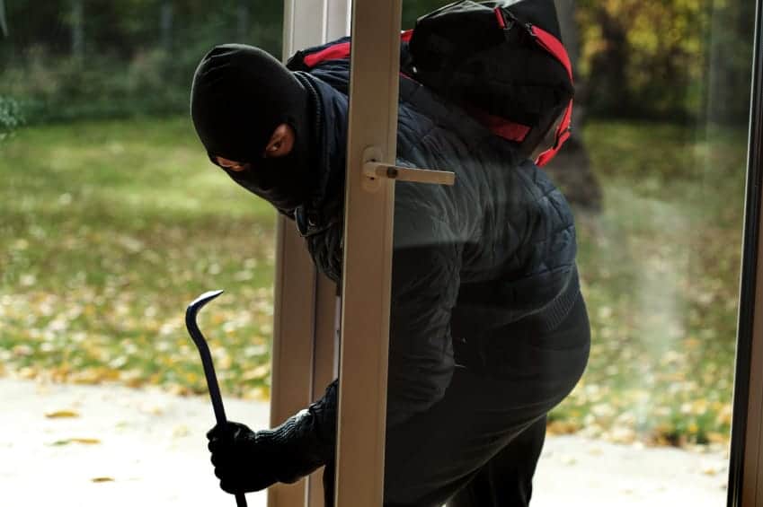 Burglar entering house