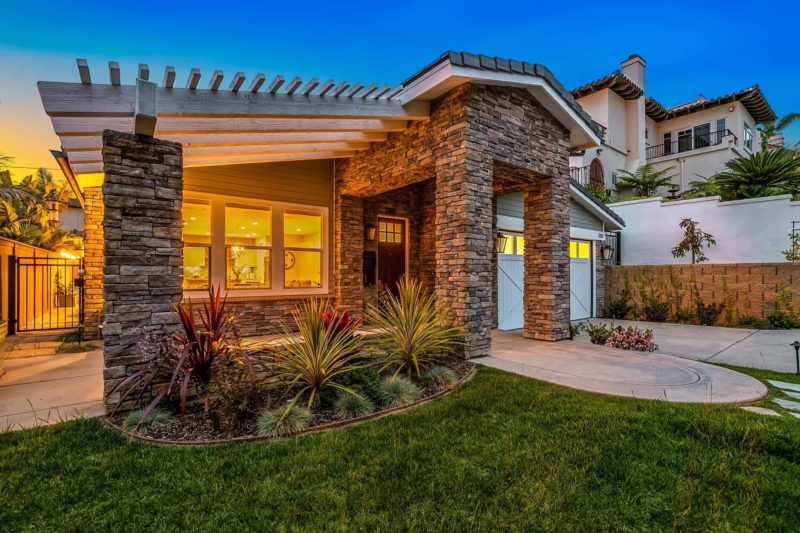 Front yard of home with xeriscaping plants for hot climates and dry weather