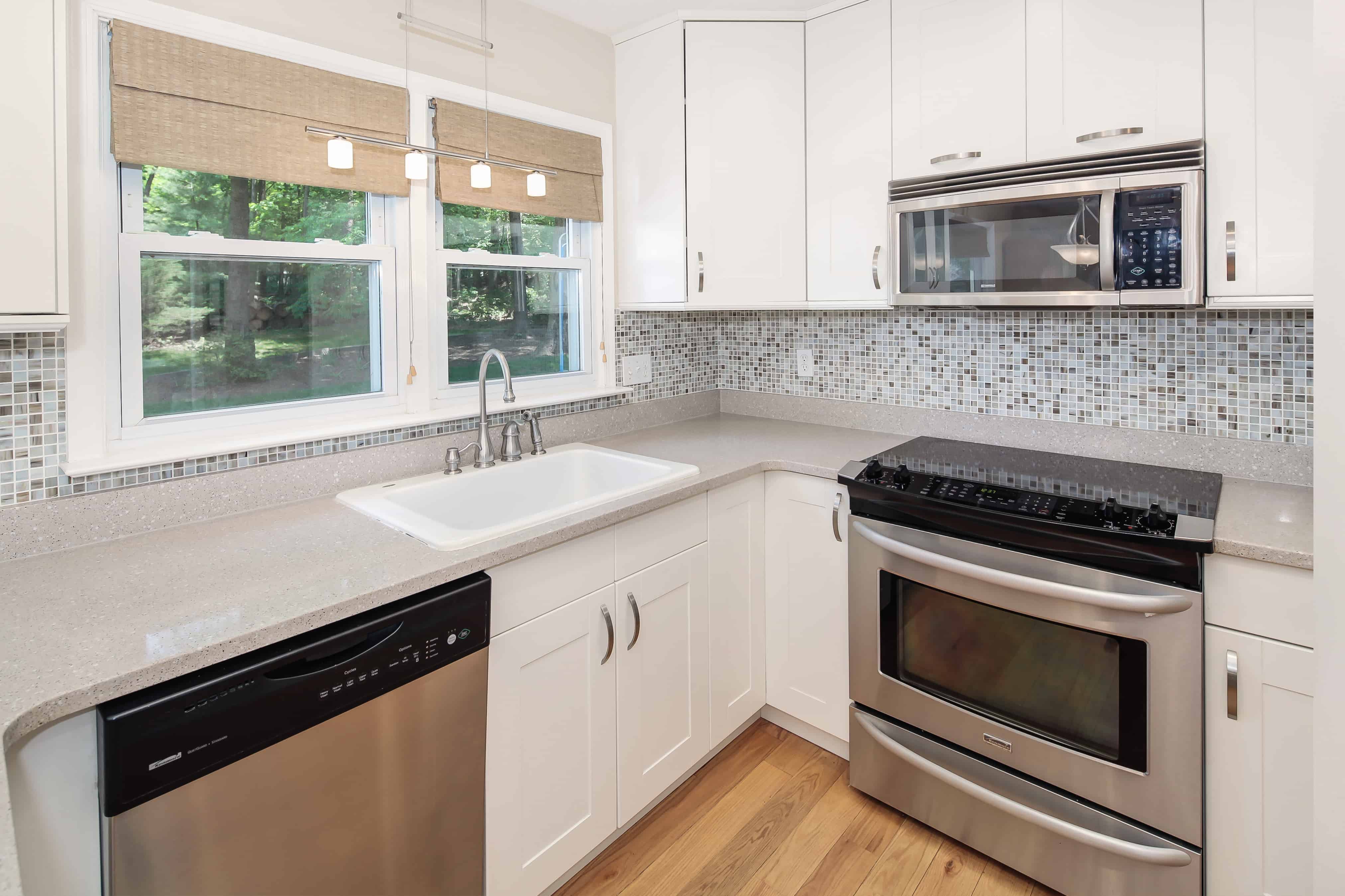 Budget kitchen with a tiled backsplash and chrome appliances