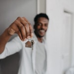 Man holding new house key