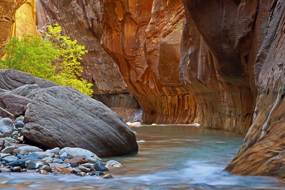 Late afternoon sunlight coming through, Virgin river, the Narrows, Zion national park, Utah, USA.