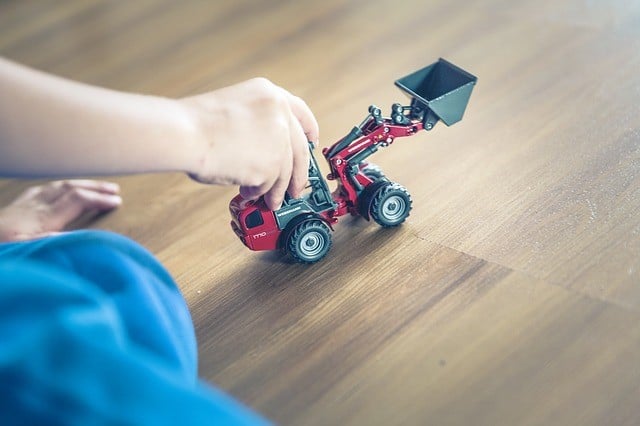 Child with toy truck