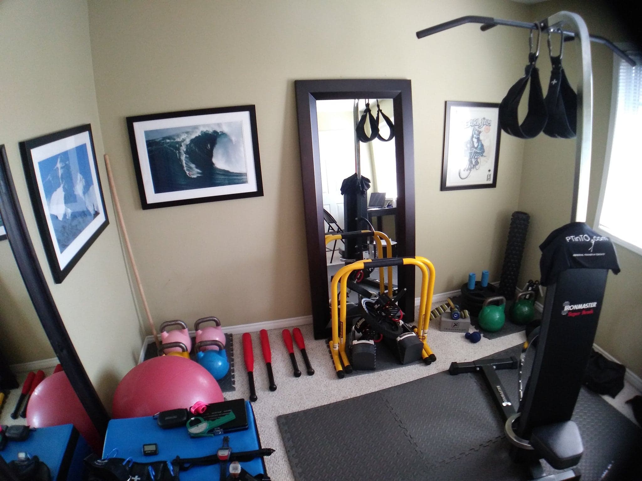 treadmill and workout equipment in room