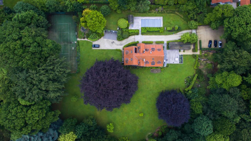 aerial photo of large house with massive yard