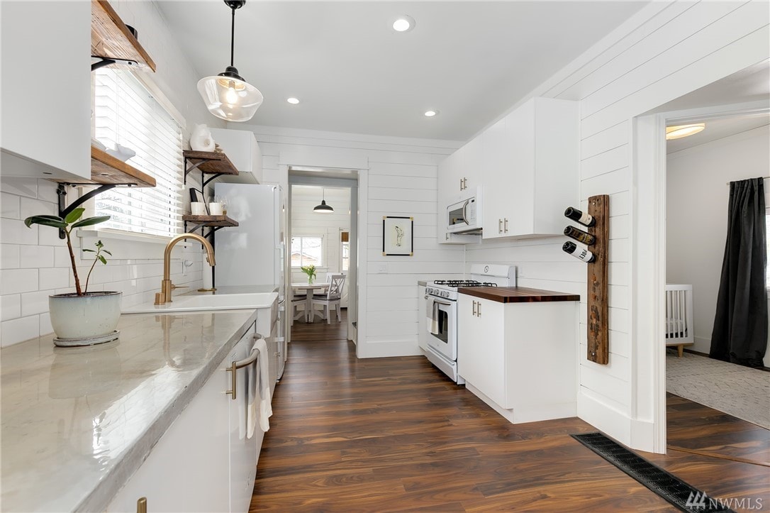 Kitchen with white shiplap wood