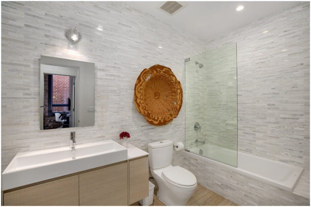 bright bathroom with large sink 
