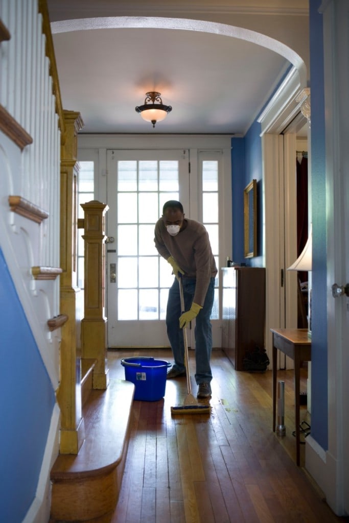 Man deep cleaning his home to prepare for sale