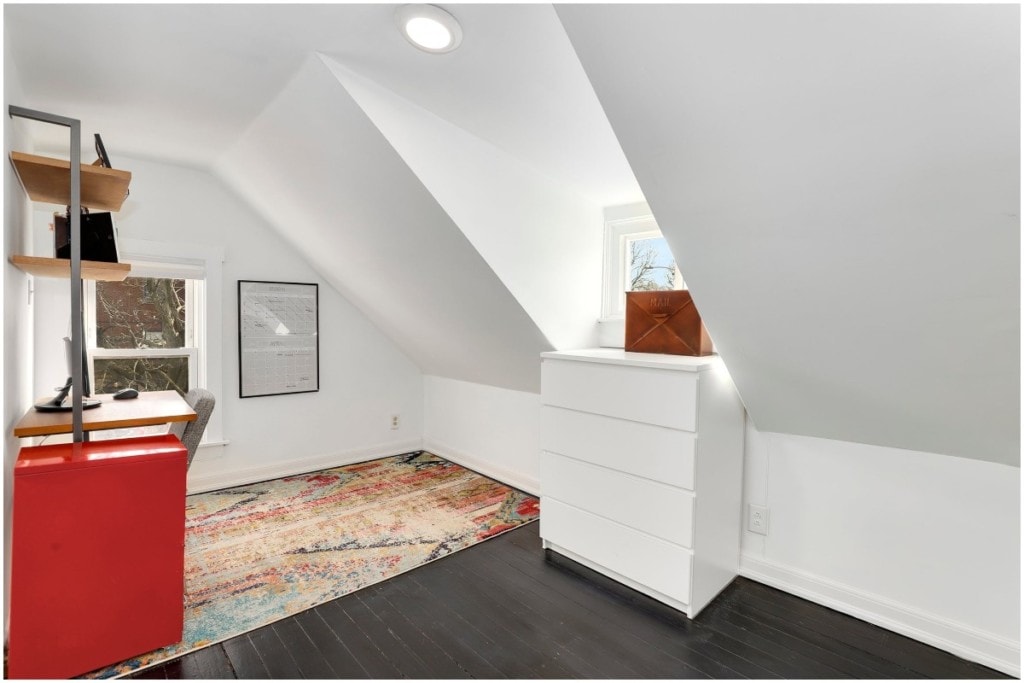 white attic home office colorful red rug natural light