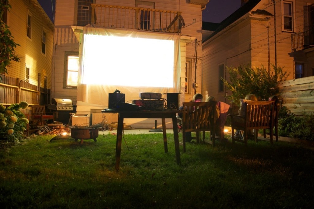 An outdoor movie theater completes this backyard oasis idea