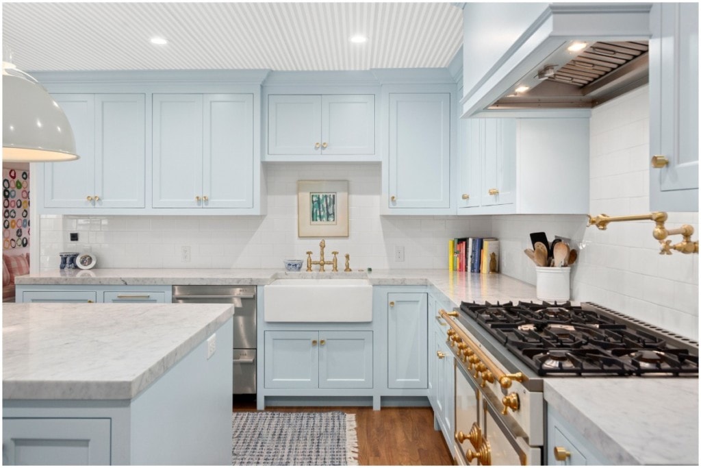 bright kitchen with blue cabinets 
