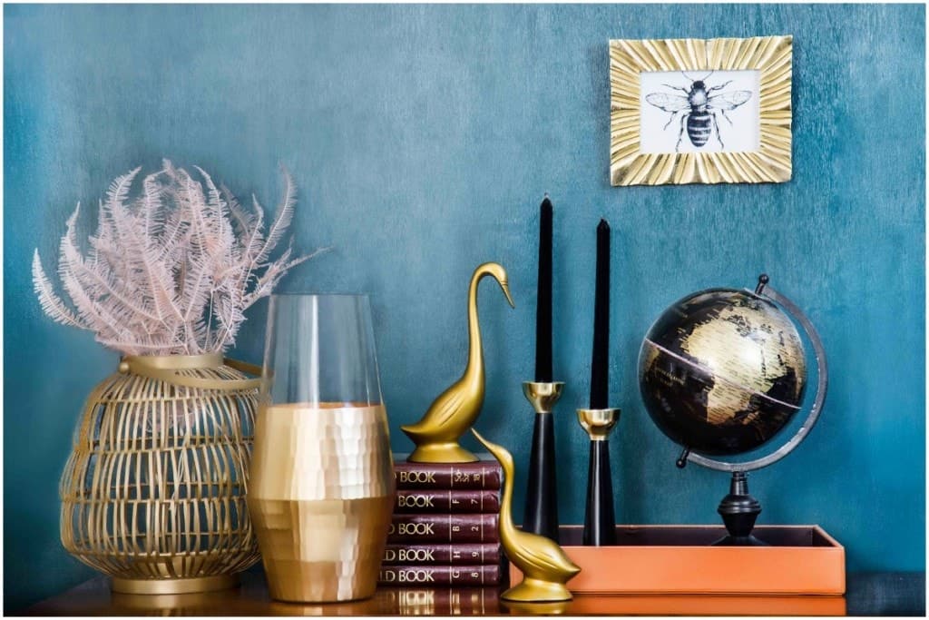 decorating on a budget with blue wall and layered accessories