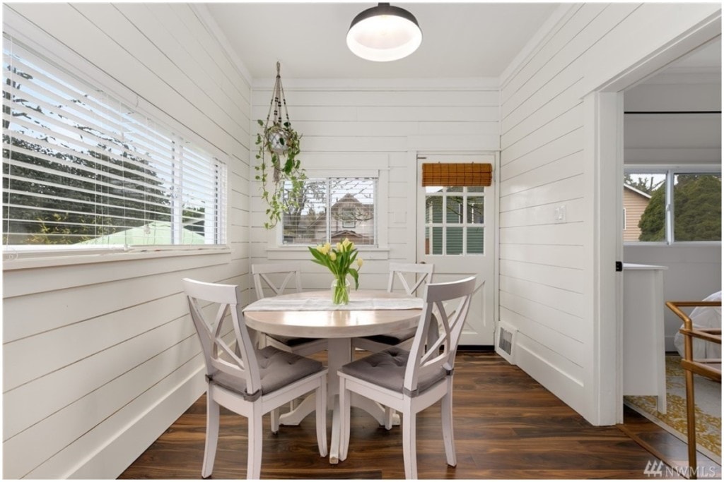 white dining area with round table