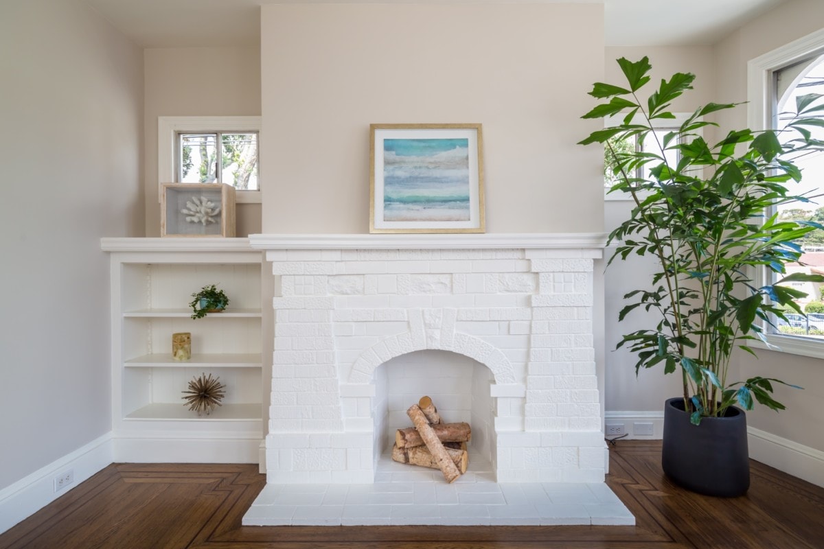 White painted brick fireplace perfectly staged for selling a home