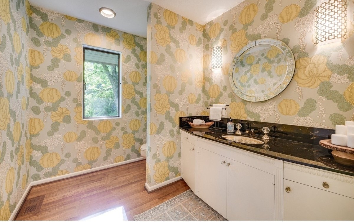 Floral wallpaper covering the walls in a bathroom