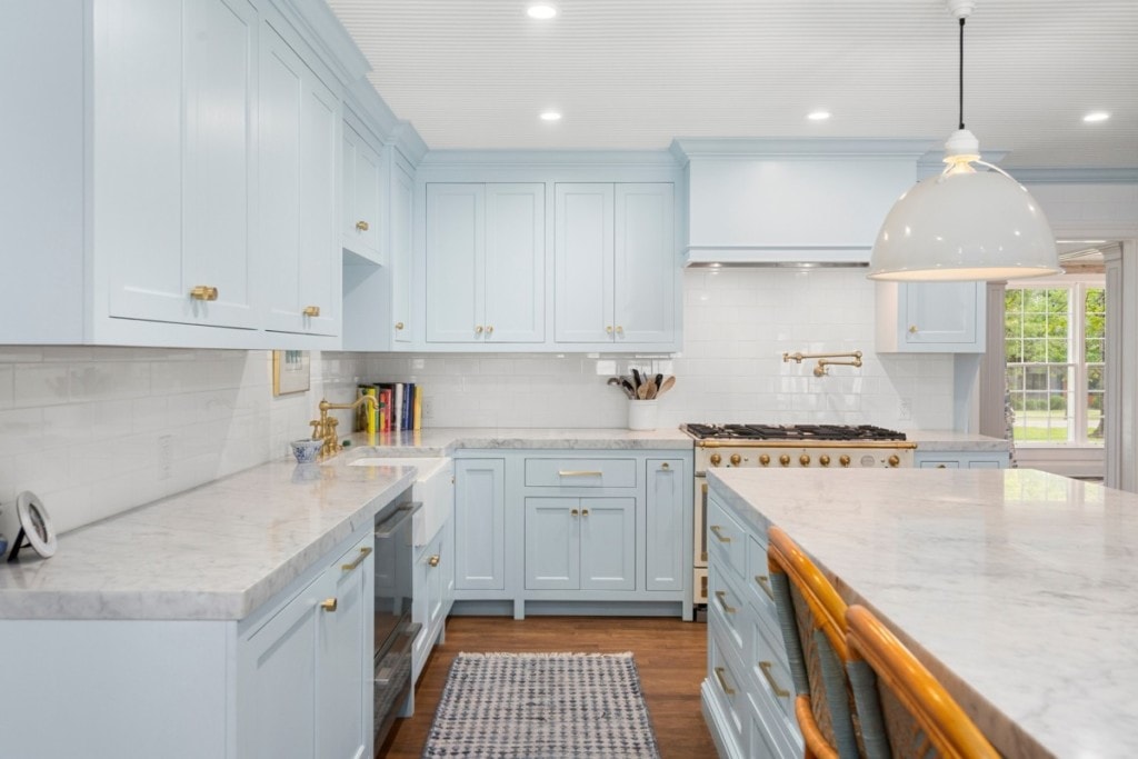 bright kitchen with blue cabinents