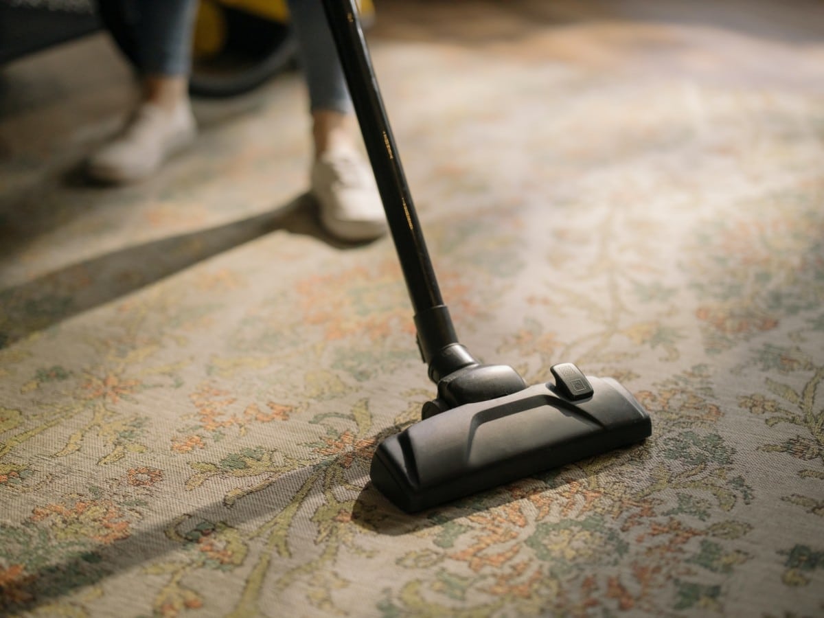 vacuuming carpet to clear bad energy 