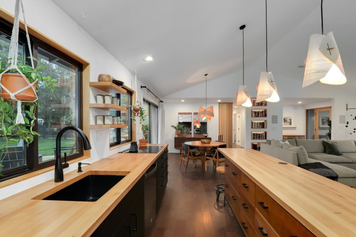 Modern kitchen with butcher block countertops and organized open shelving