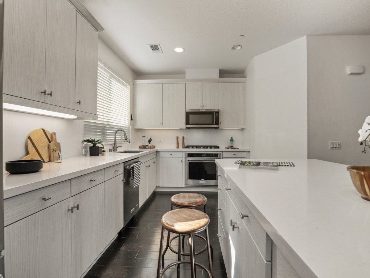 updated white kitchen stainless steel appliances