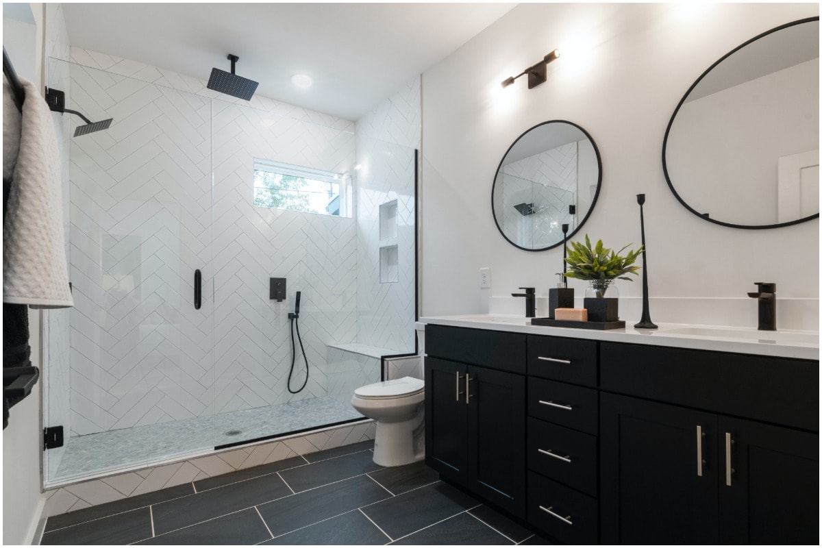 A large, white bathroom with a shower seat