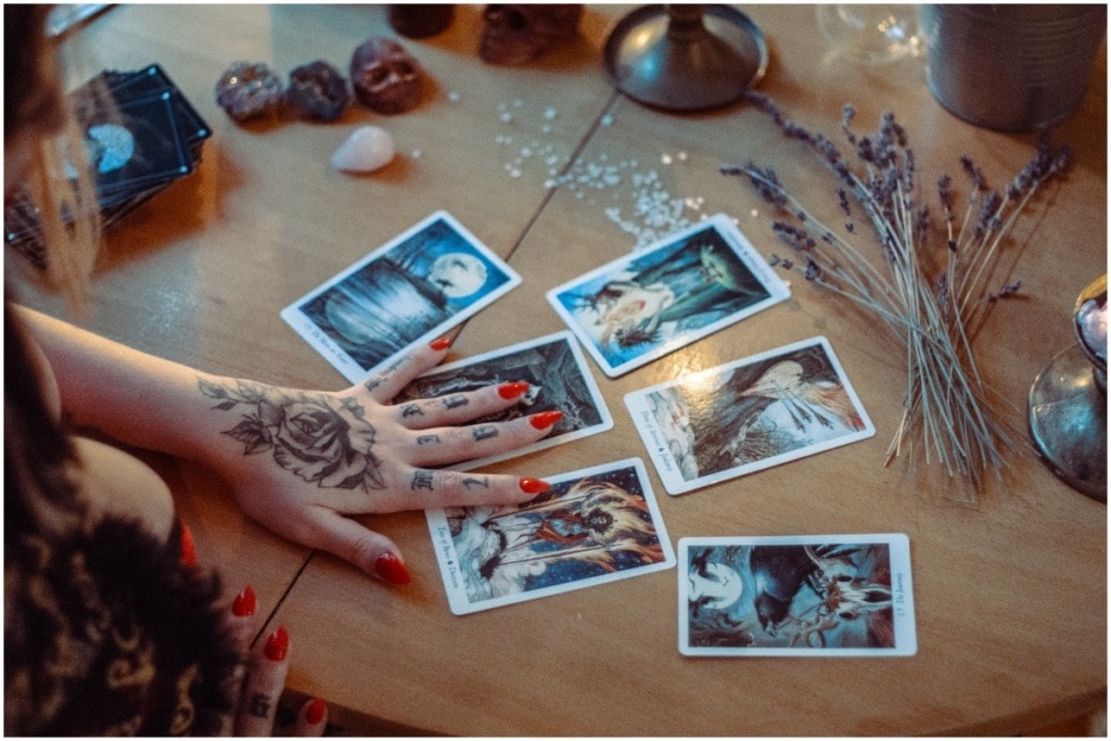 Tarot cards laid out on desk 