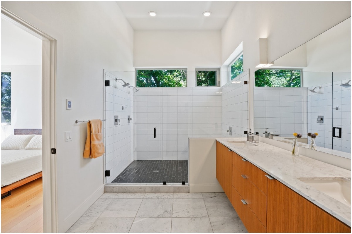 a white bathroom with cedar cabinets