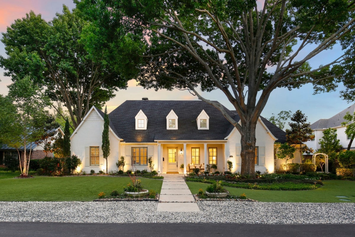 A single-story white home sold with a listing agent 