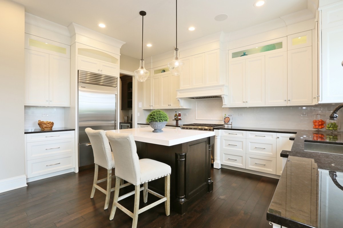 White cabinets with brown kitchen island