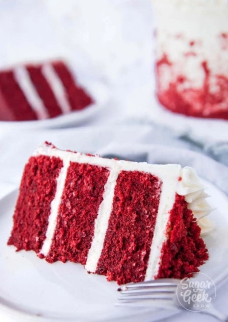 Beautiful red velvet layer cake topped with cream cheese frosting 