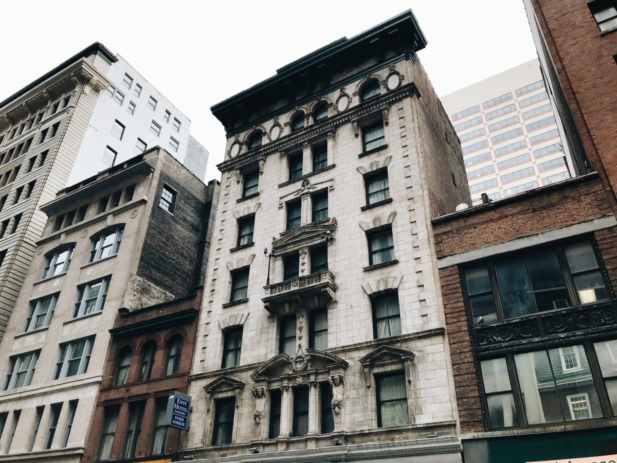 beaux arts style row house white in color