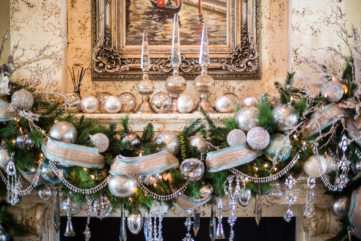 silver and ornately decorated mantle with gold and silver decor