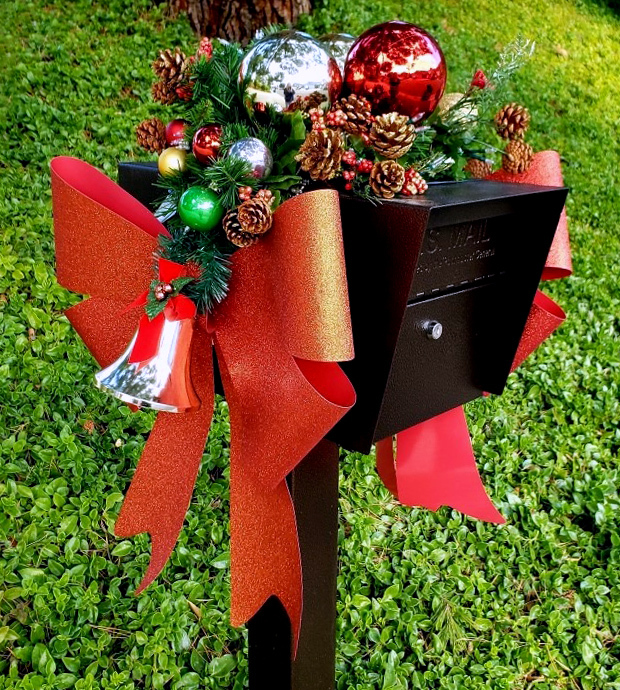 black mail box with holiday decor ideas and a red bow with baubles