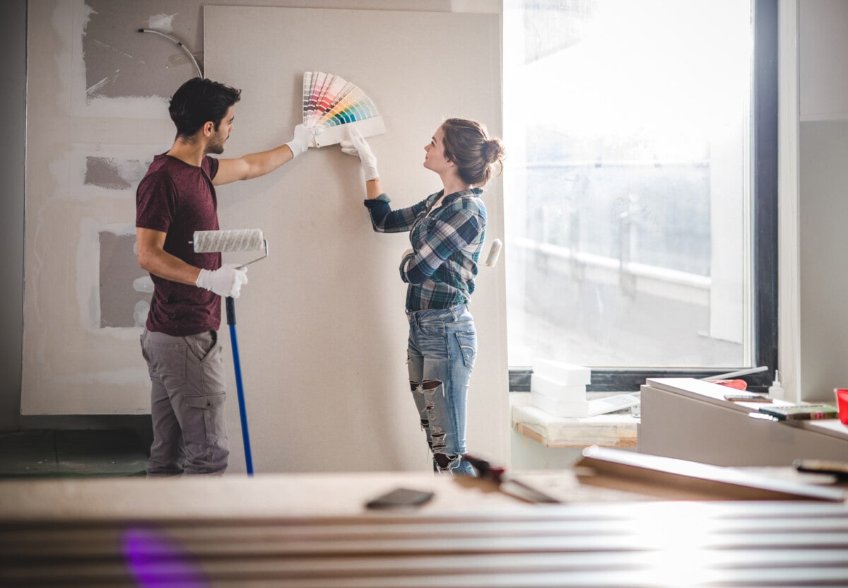 Couple choosing overgarment colors for their home