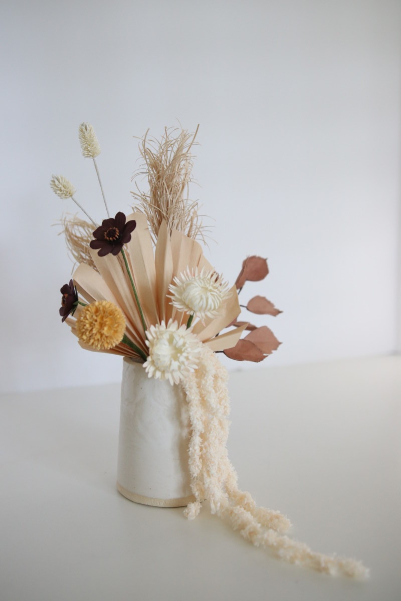 paper flower bouquet in pastel shades with some dark colors