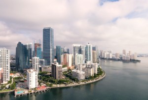 picture of downtown miami buildings with the coast line and cloudy sky