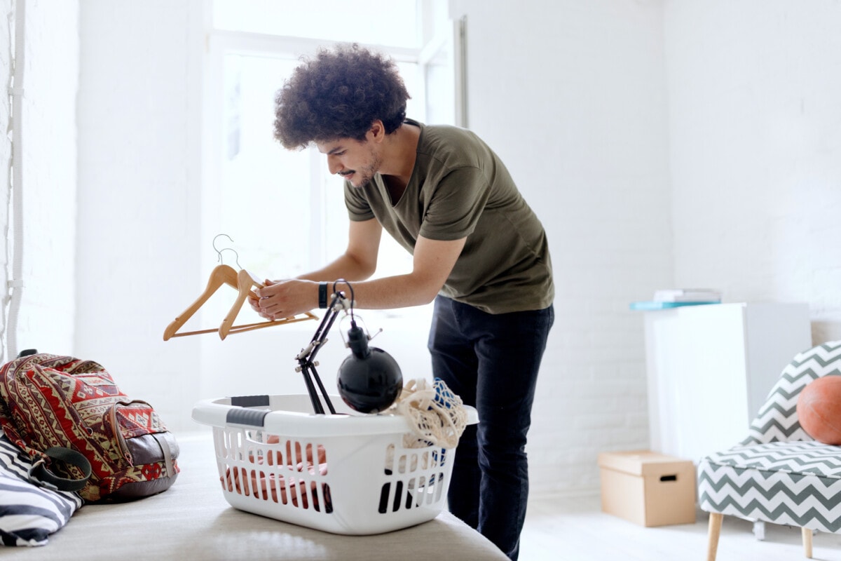 young student unpacking first apartment _ getty