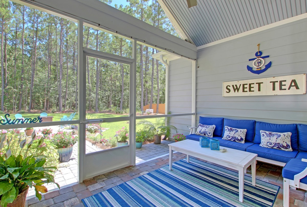 blue enclosed patio or sunroom with a tropical blue furnishings