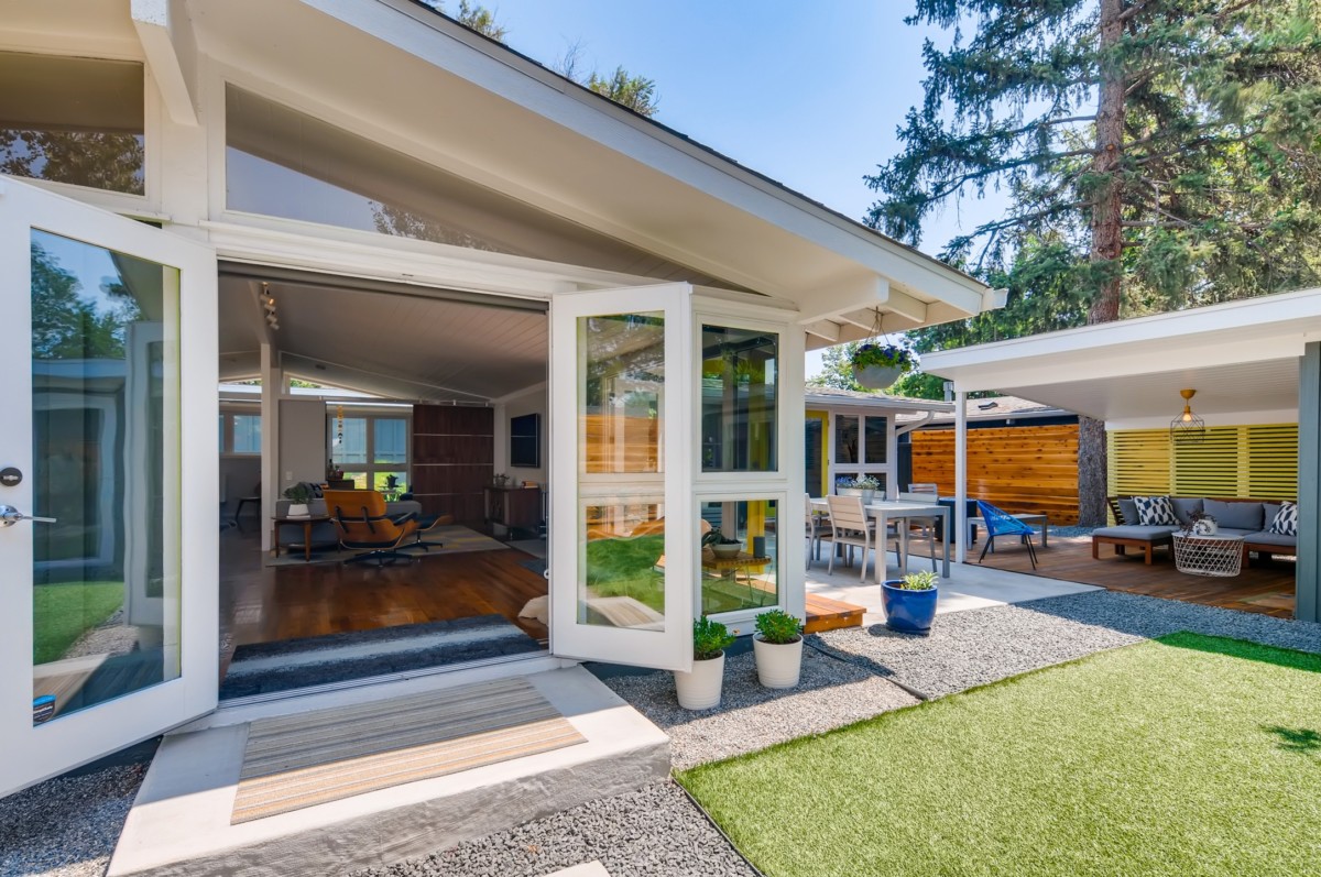 indoor outdoor living space with open doors for ventilation adds to the sustainability of the home