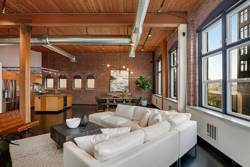 loft with large windows and rustic charm
