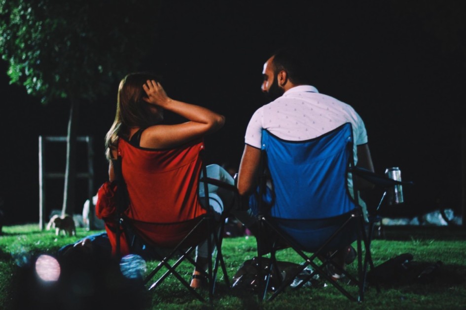 Couple sitting in lawn chairs