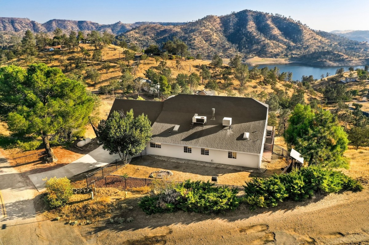 home with a sloped roof and view of mountains