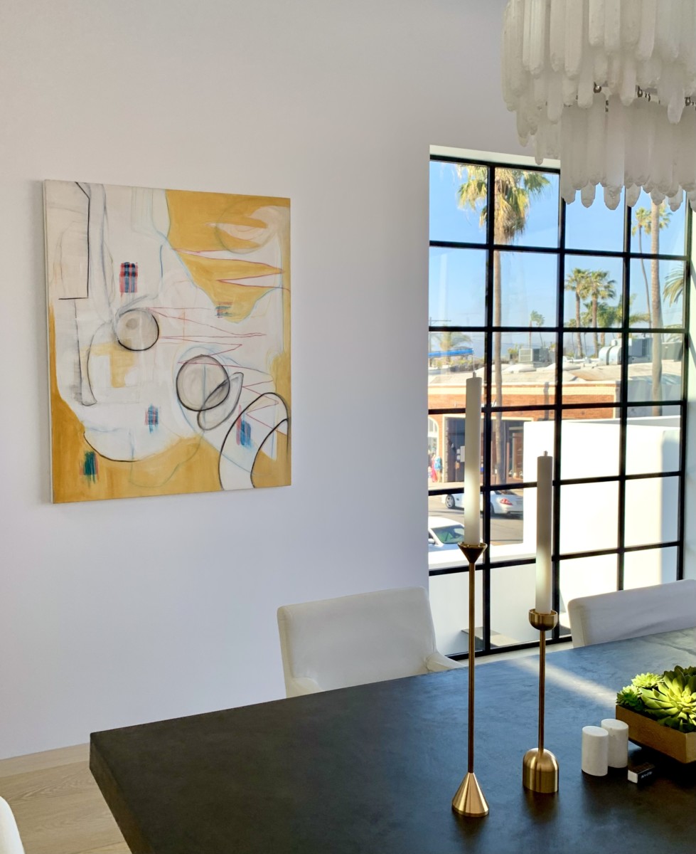 yellow abstract art in a dining room space