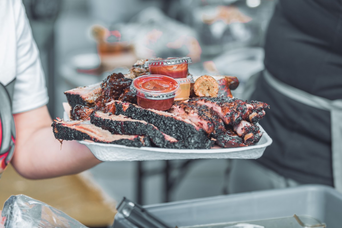 BBQ plate with ribs and sauces 