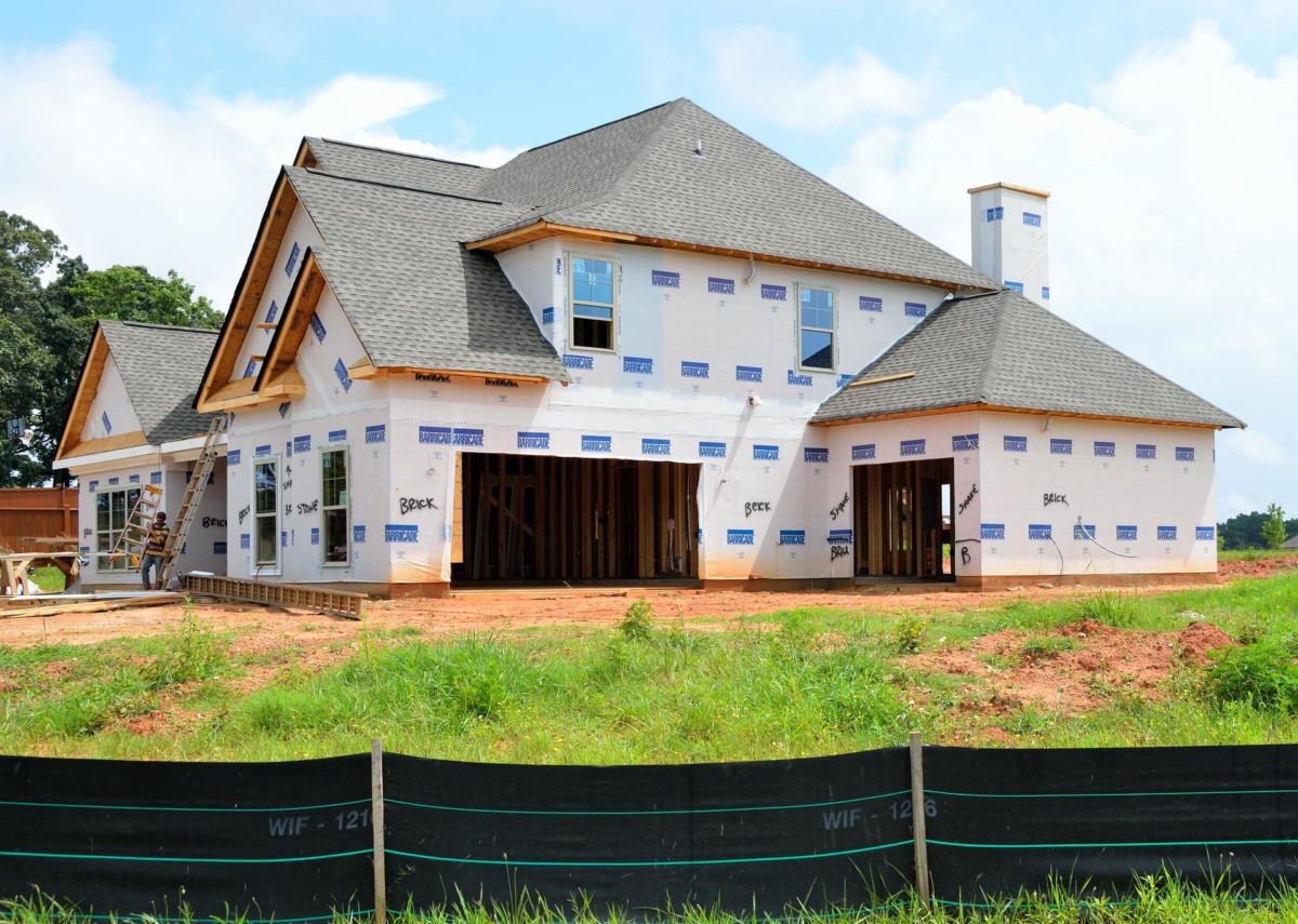 two-story house under construction