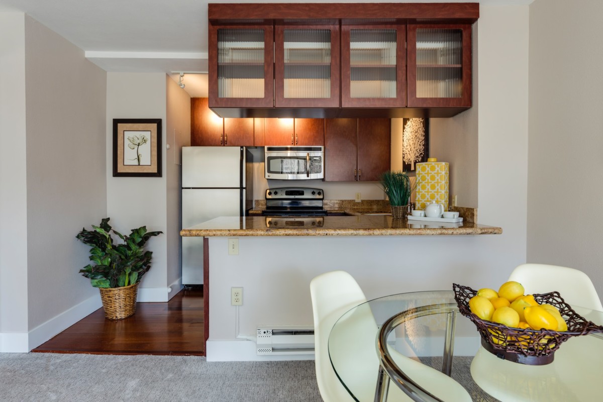 apartment kitchen with dining table in front