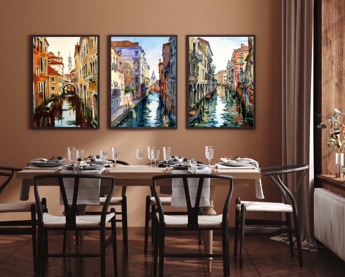 three paintings in a dining room