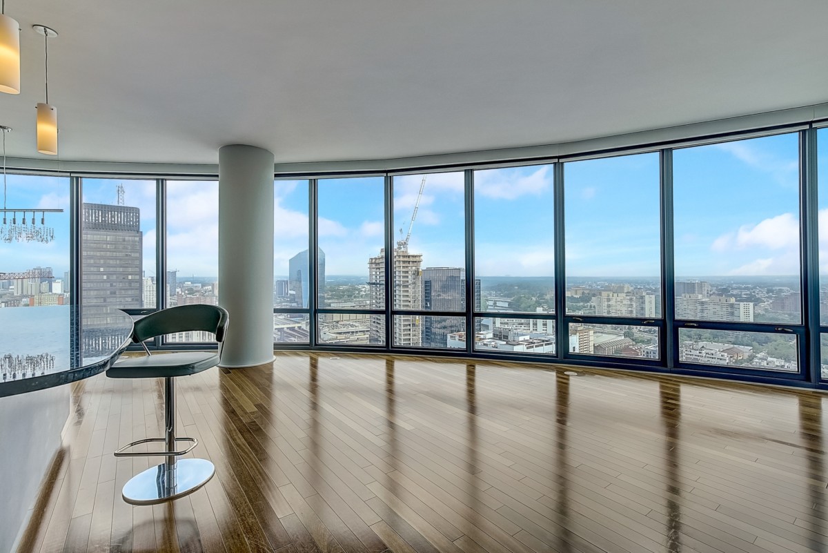 empty apartment with two chairs and no other furniture