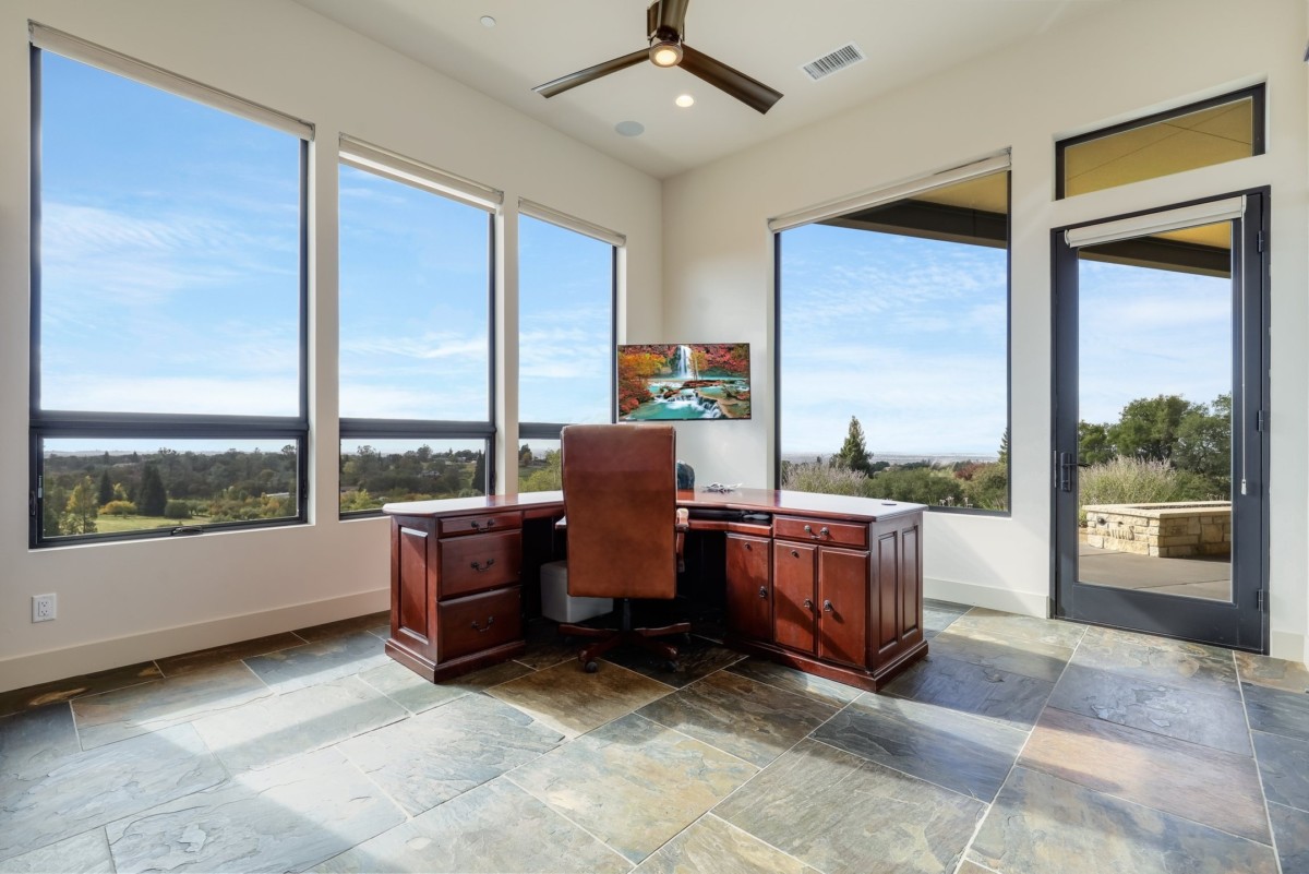 natural stone floors in an office room with a view of the outside