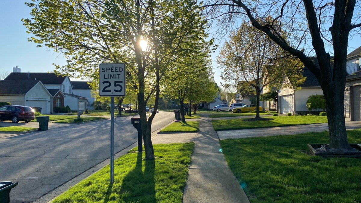 street in affordable suburb in cininnati on clear day 