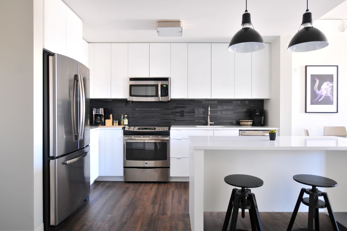 apartment kitchen with a dark brown floor