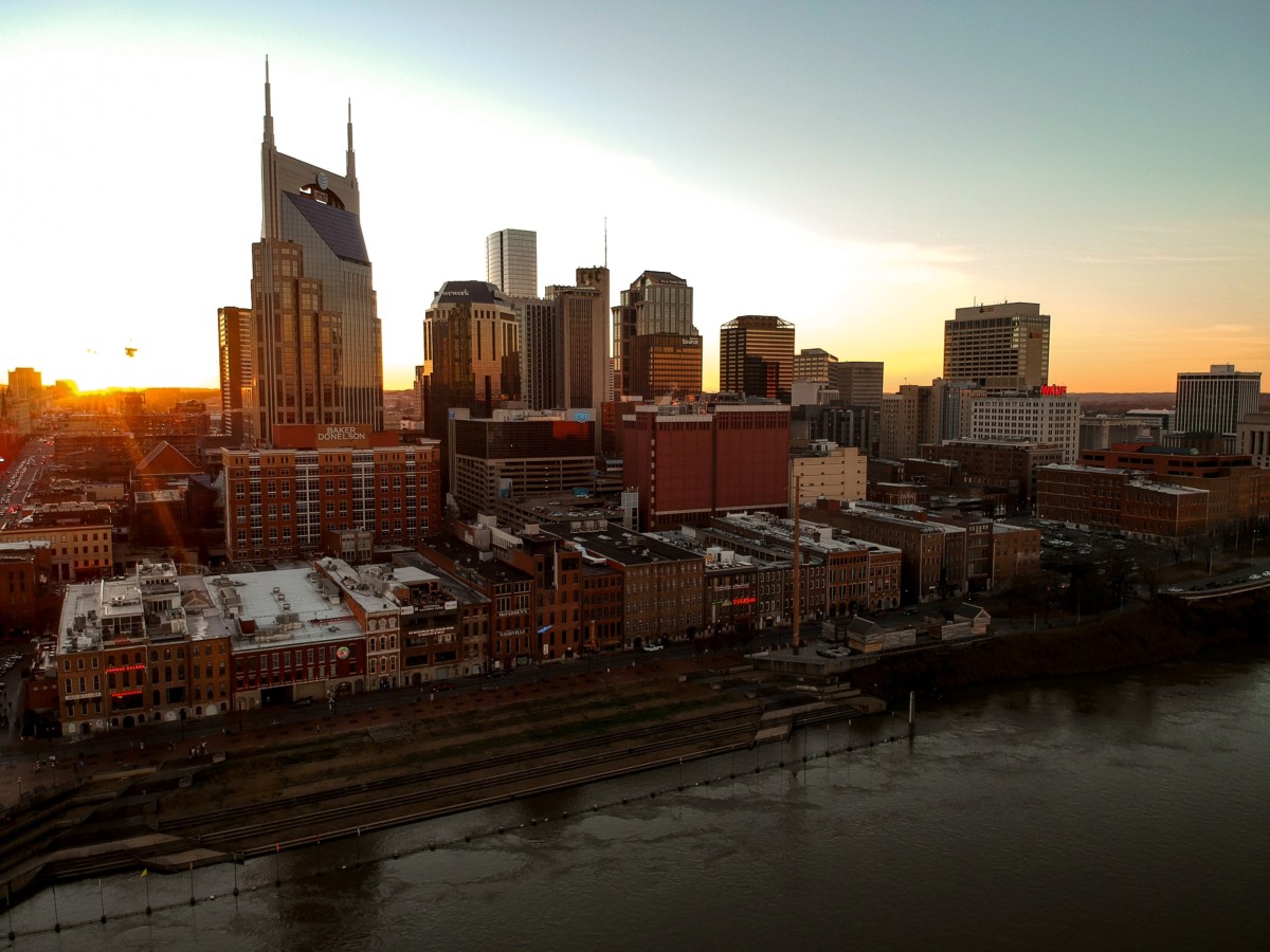nashville skyline at dusk with the river in the front